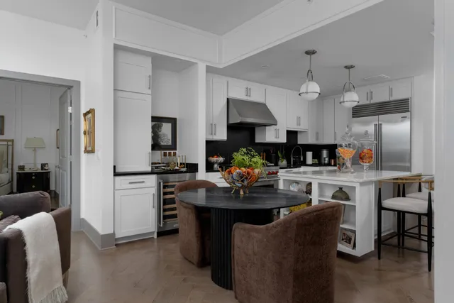 a kitchen with cabinets a sink and appliances