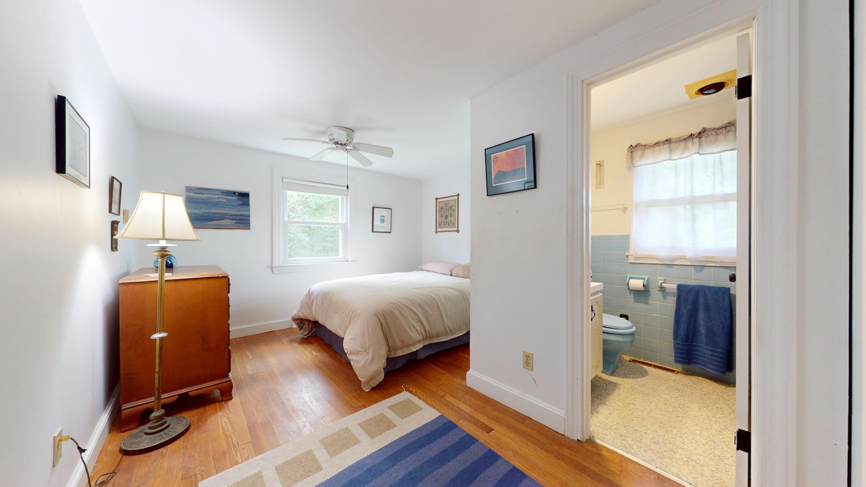 55 Monument View Road East Dennis, MA 02660 - Photo 22 of 40 a bedroom with bed and wooden floor
