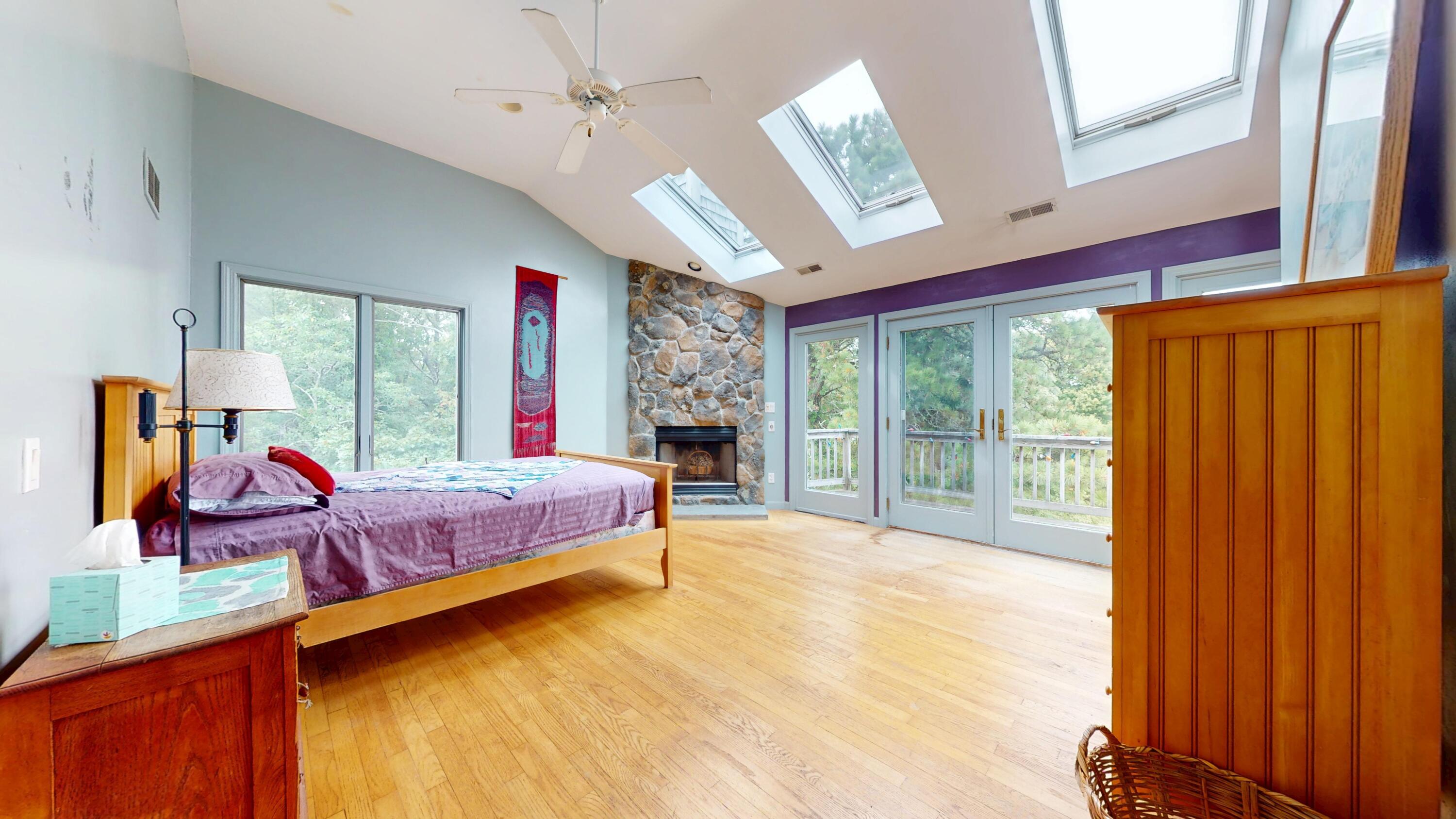 55 Monument View Road East Dennis, MA 02660 - Photo 25 of 40 a bedroom with a bed dresser and a window