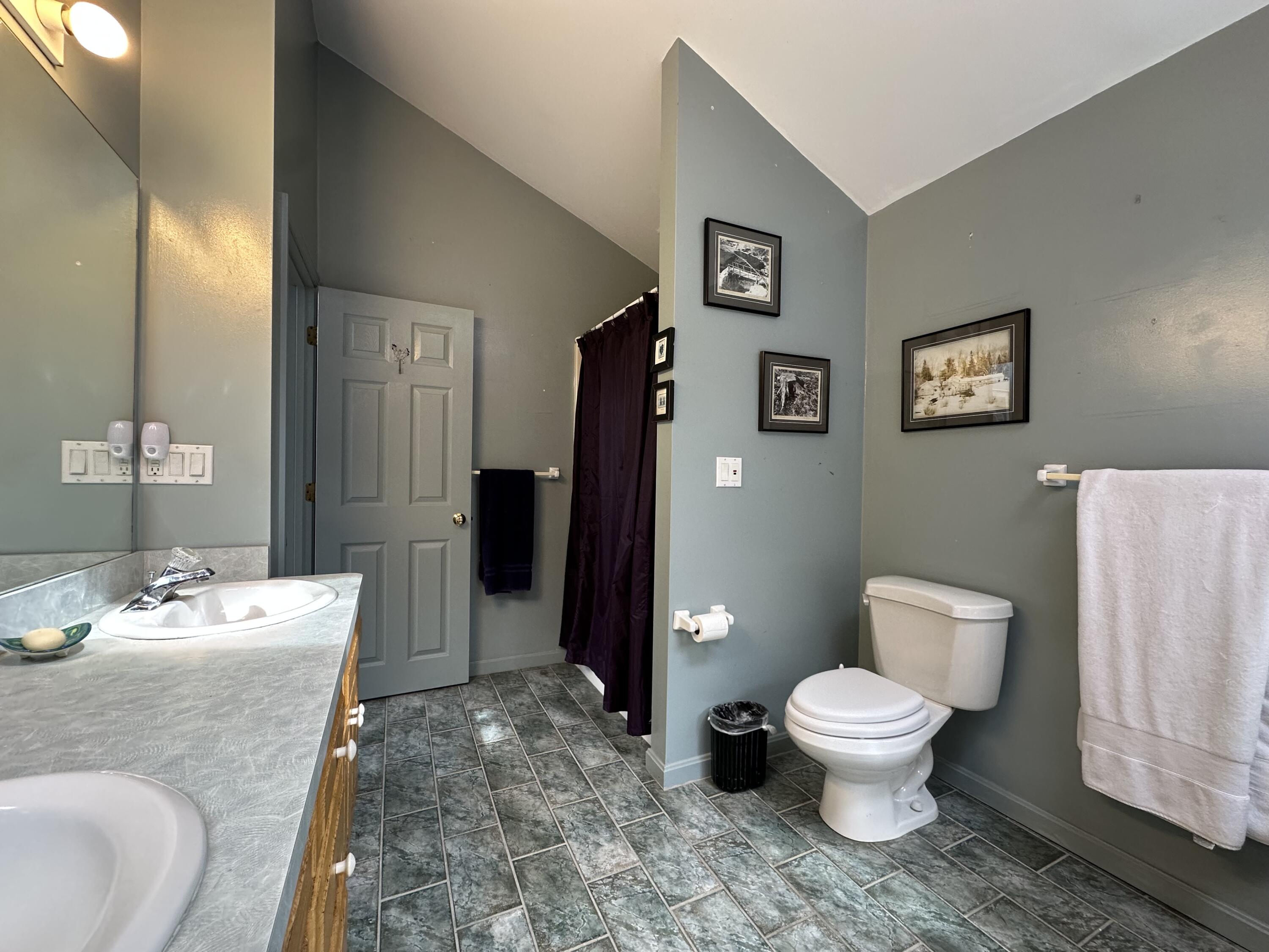 55 Monument View Road East Dennis, MA 02660 - Photo 29 of 40 a bathroom with a toilet sink and mirror