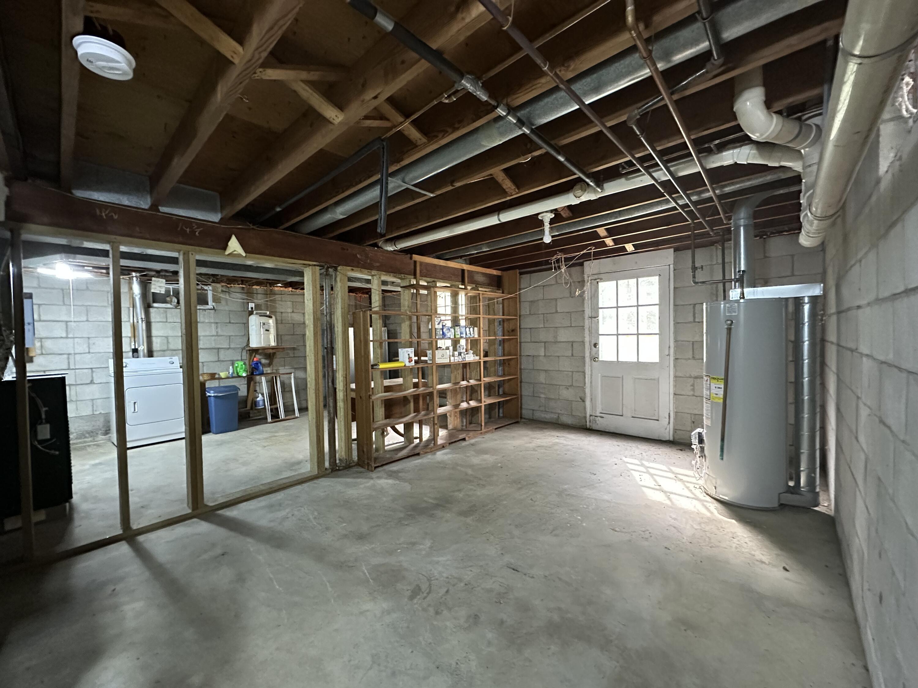 55 Monument View Road East Dennis, MA 02660 - Photo 32 of 40 a view of an empty room with refrigerator and windows