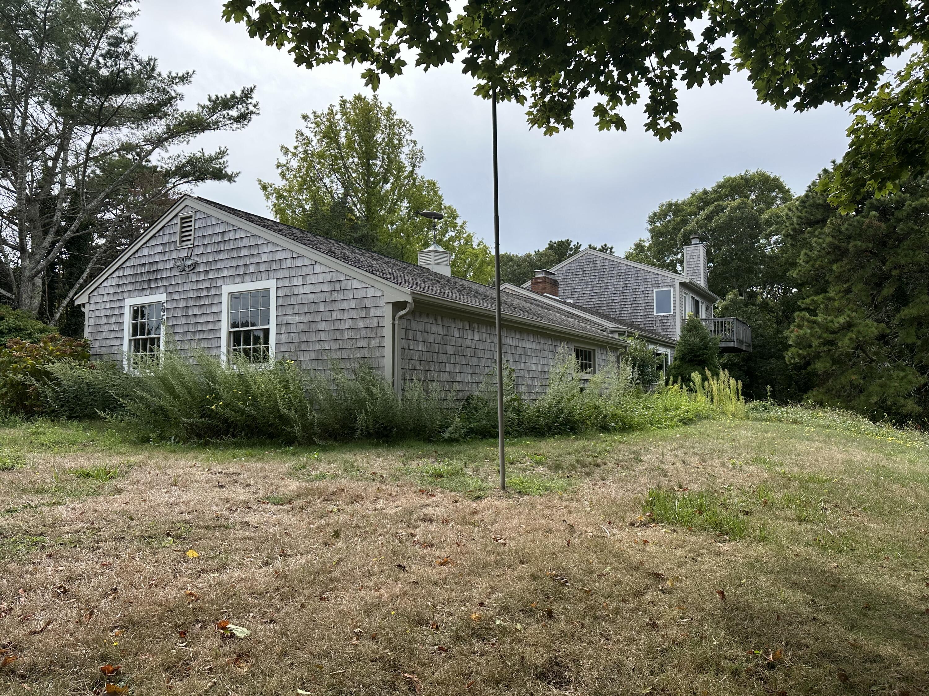 55 Monument View Road East Dennis, MA 02660 - Photo 38 of 40 a view of a house with a yard and tree s