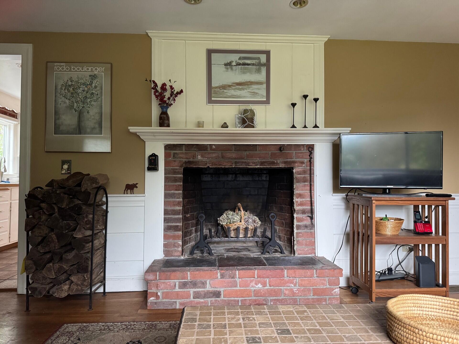 55 Monument View Road East Dennis, MA 02660 - Photo 5 of 40 a living room with furniture and a fireplace