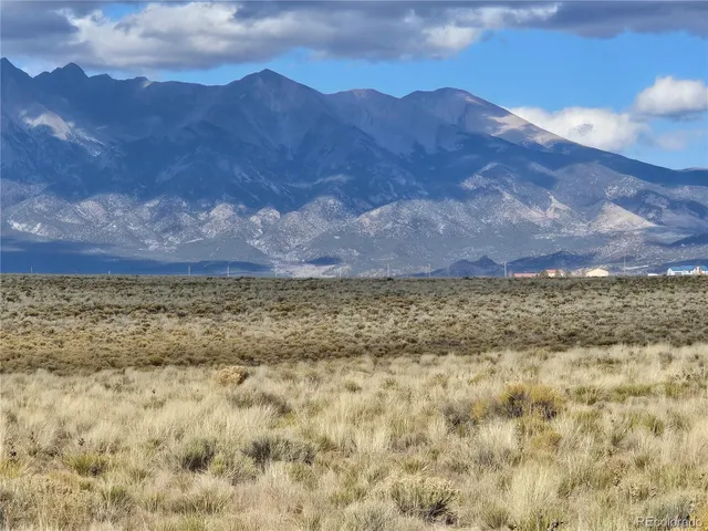 a view of mountain and tree