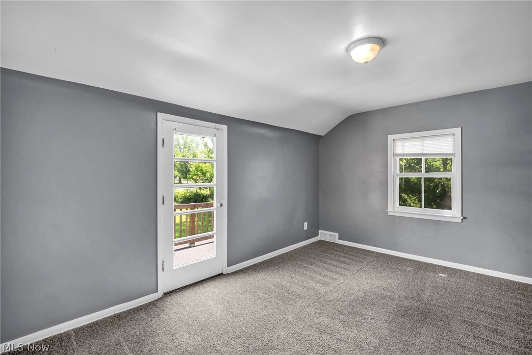 2313 North Taylor Road Cleveland Heights, OH 44112 - Photo 11 of 32 Carpeted room with a white-framed glass paneled door opening to an outdoor deck