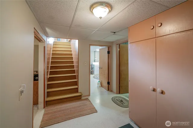 a view of entryway with stairs and a chandelier