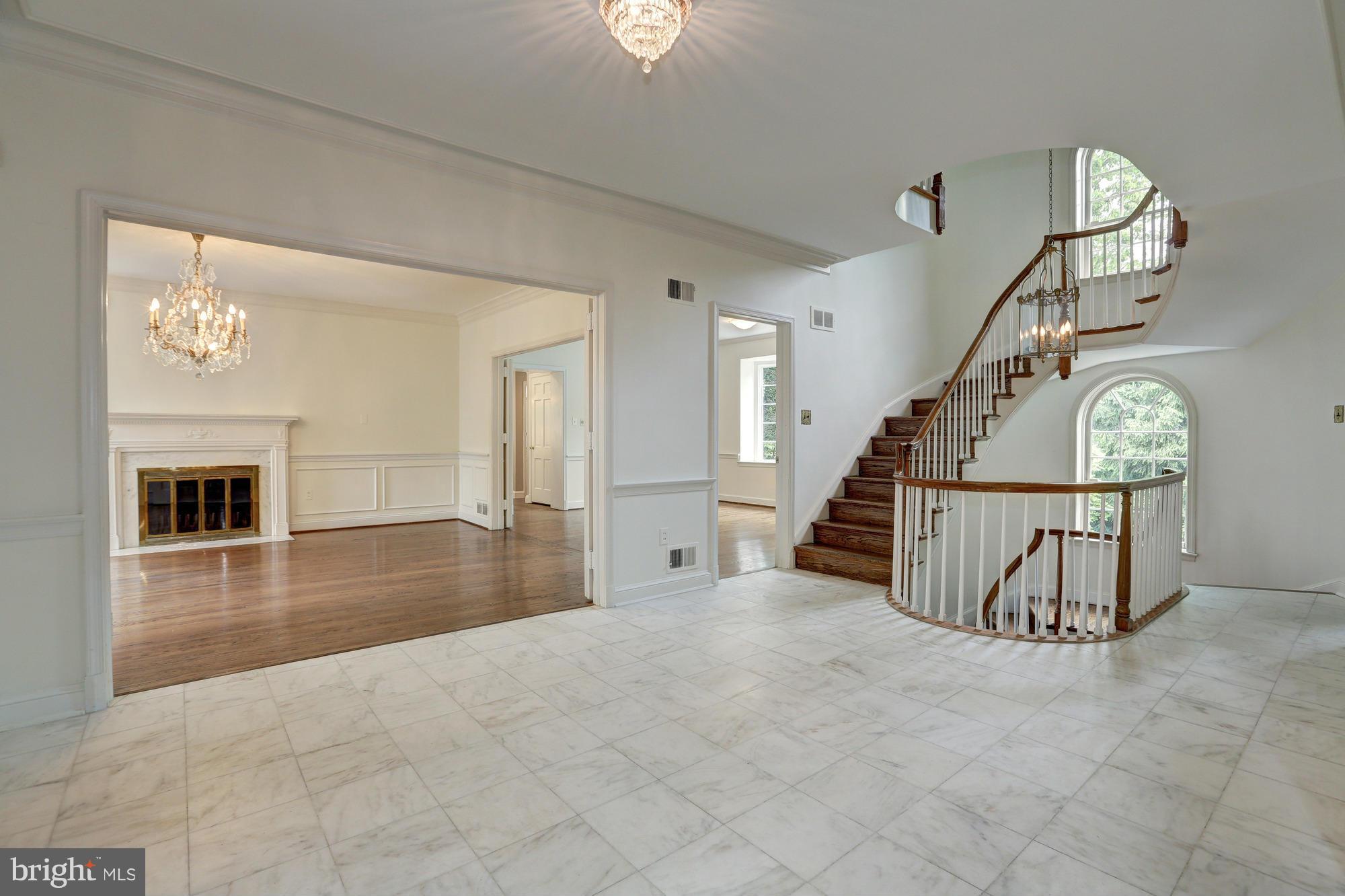 4911 Loughboro Road Northwest Washington, DC 20016 - Photo 4 of 28 Entry Foyer to Dining Room with Fireplace