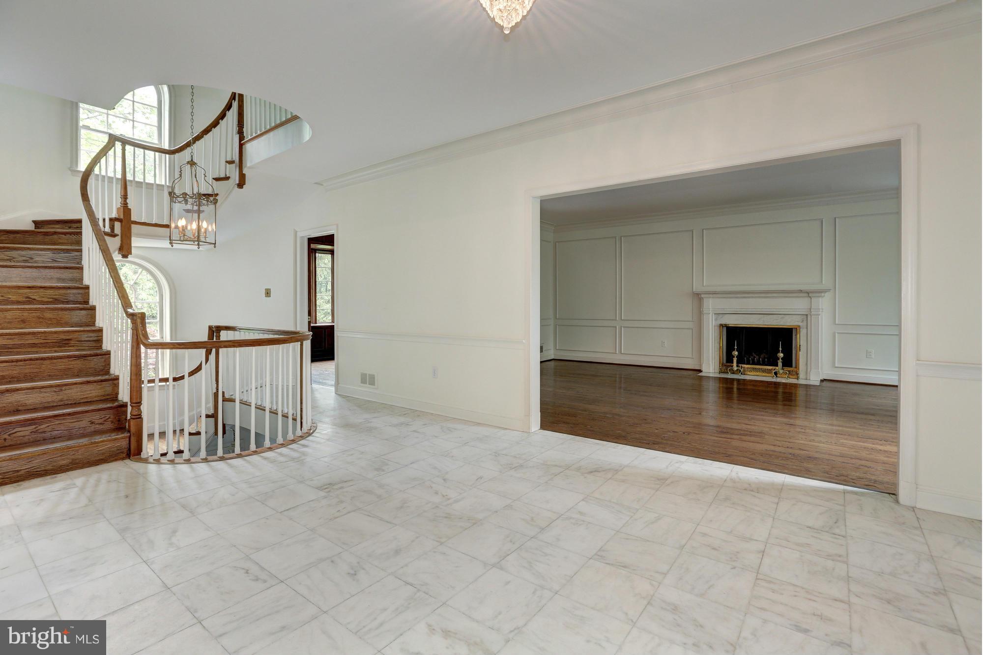 4911 Loughboro Road Northwest Washington, DC 20016 - Photo 5 of 28 Entry Foyer to Living Room with Fireplace