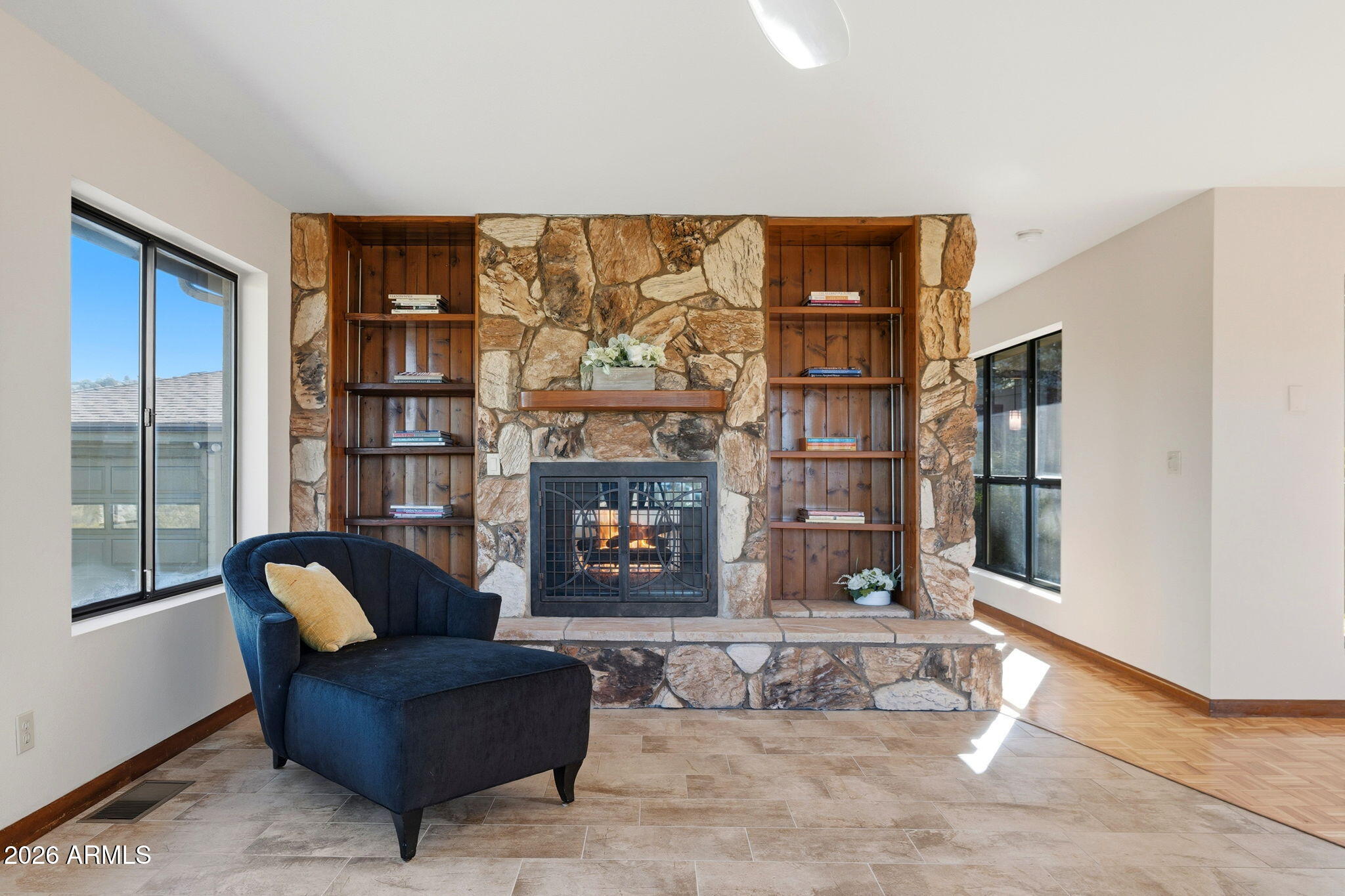 220 High Chaparral Loop Prescott, AZ 86303 - Photo 11 of 42 a living room with furniture a floor to ceiling window and cabinet