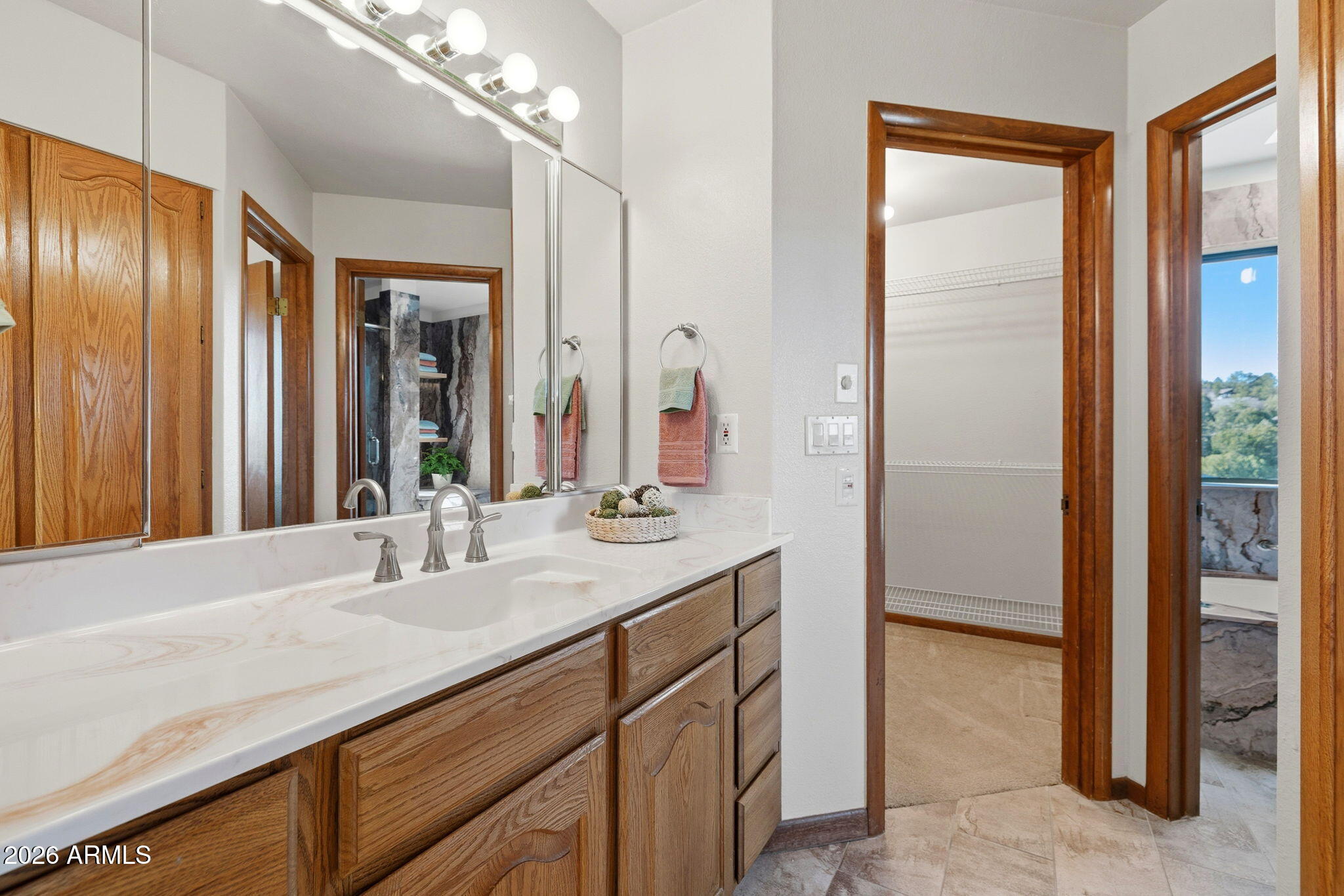 220 High Chaparral Loop Prescott, AZ 86303 - Photo 21 of 42 a bathroom with a double vanity sink and a mirror