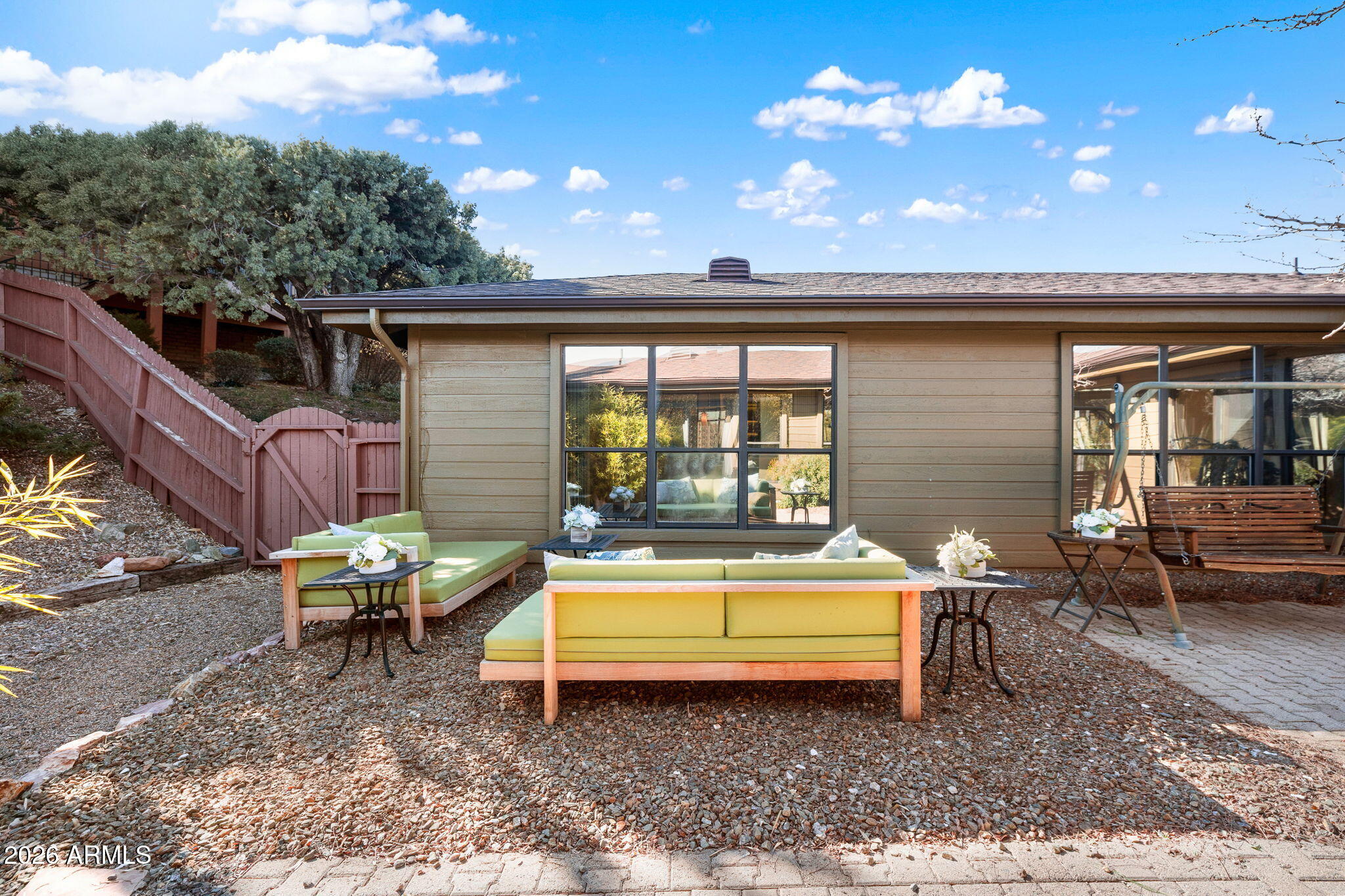 220 High Chaparral Loop Prescott, AZ 86303 - Photo 32 of 42 a backyard of a house with table and chairs