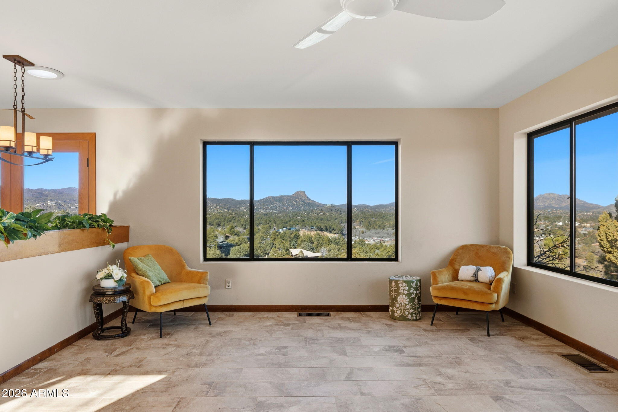 220 High Chaparral Loop Prescott, AZ 86303 - Photo 10 of 42 a living room with a couch and a floor to ceiling window