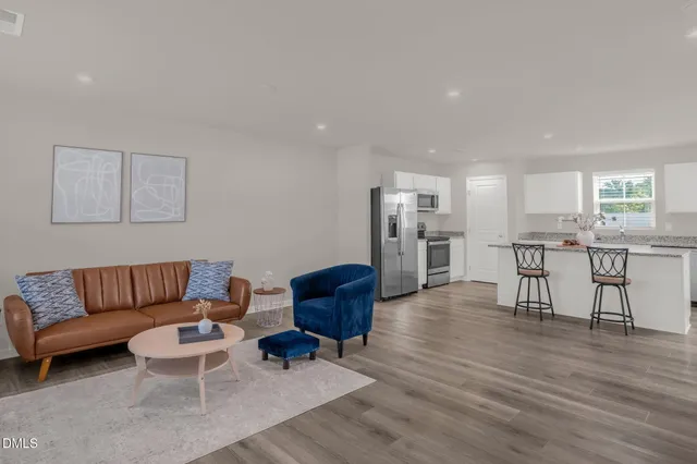 a living room with furniture and a window