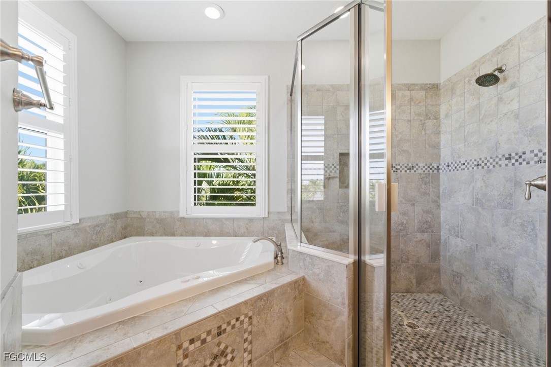12304 Boat Shell Drive Matlacha Isles, FL 33991 - Photo 26 of 49 a bathroom with a bathtub and shower