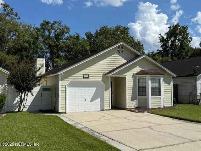 a kitchen with stainless steel appliances granite countertop a refrigerator a sink and a stove