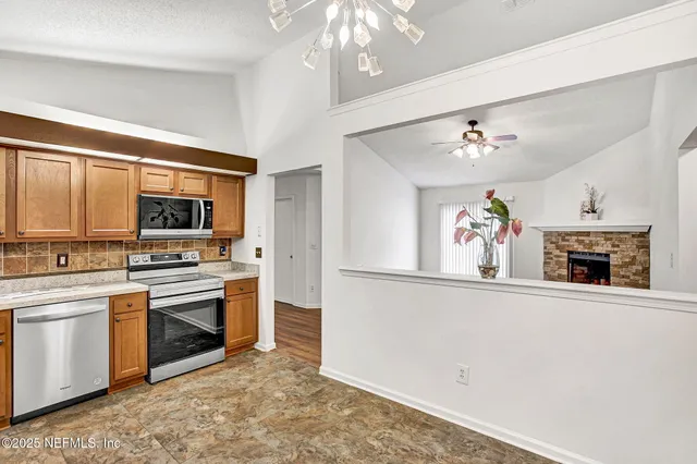a bathroom with a sink mirror toilet and shower