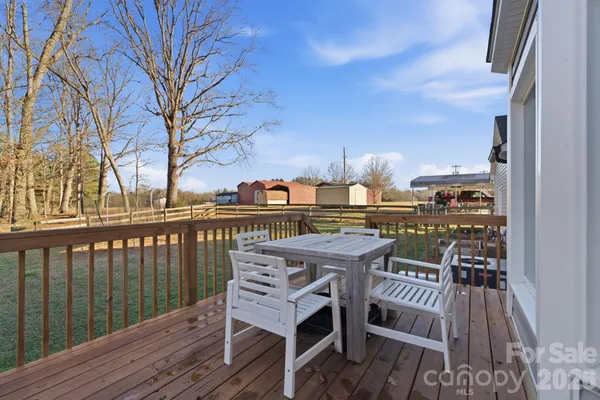 a view of a balcony with wooden floor