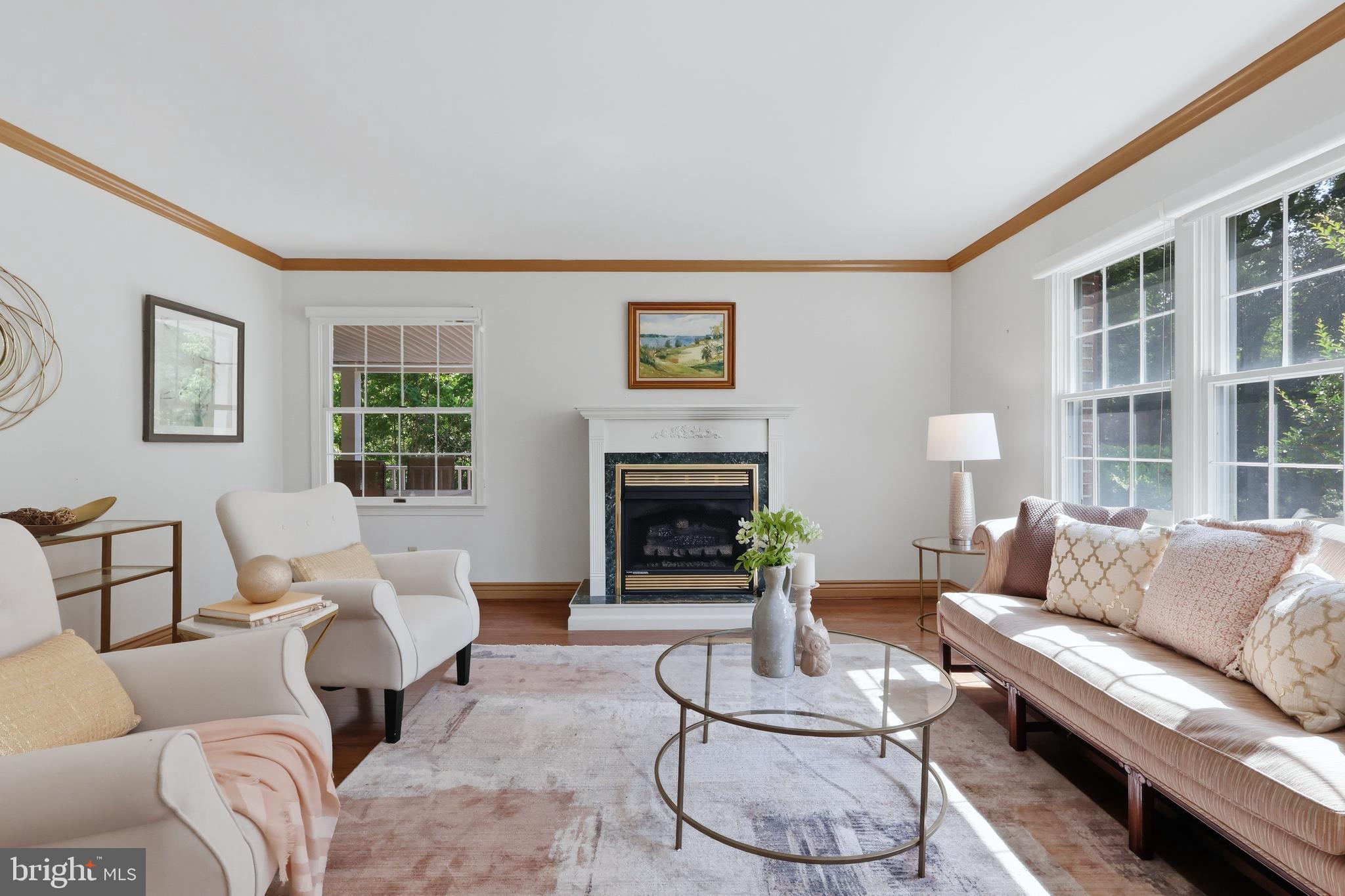 23500 River Road Lexington Park, MD 20653 - Photo 32 of 92 a living room with furniture a fireplace and a large window