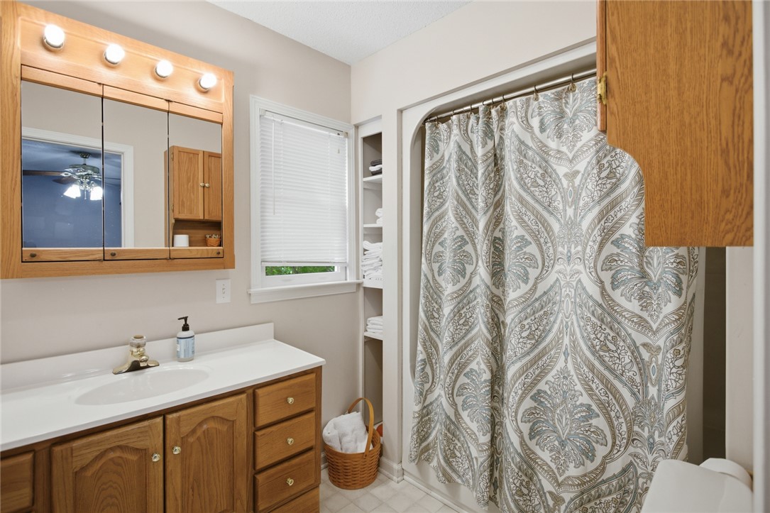 110 Snug Harbor Road Seneca, SC 29678 - Photo 17 of 37 This bathroom provides functionality with a sink, storage, and natural light.