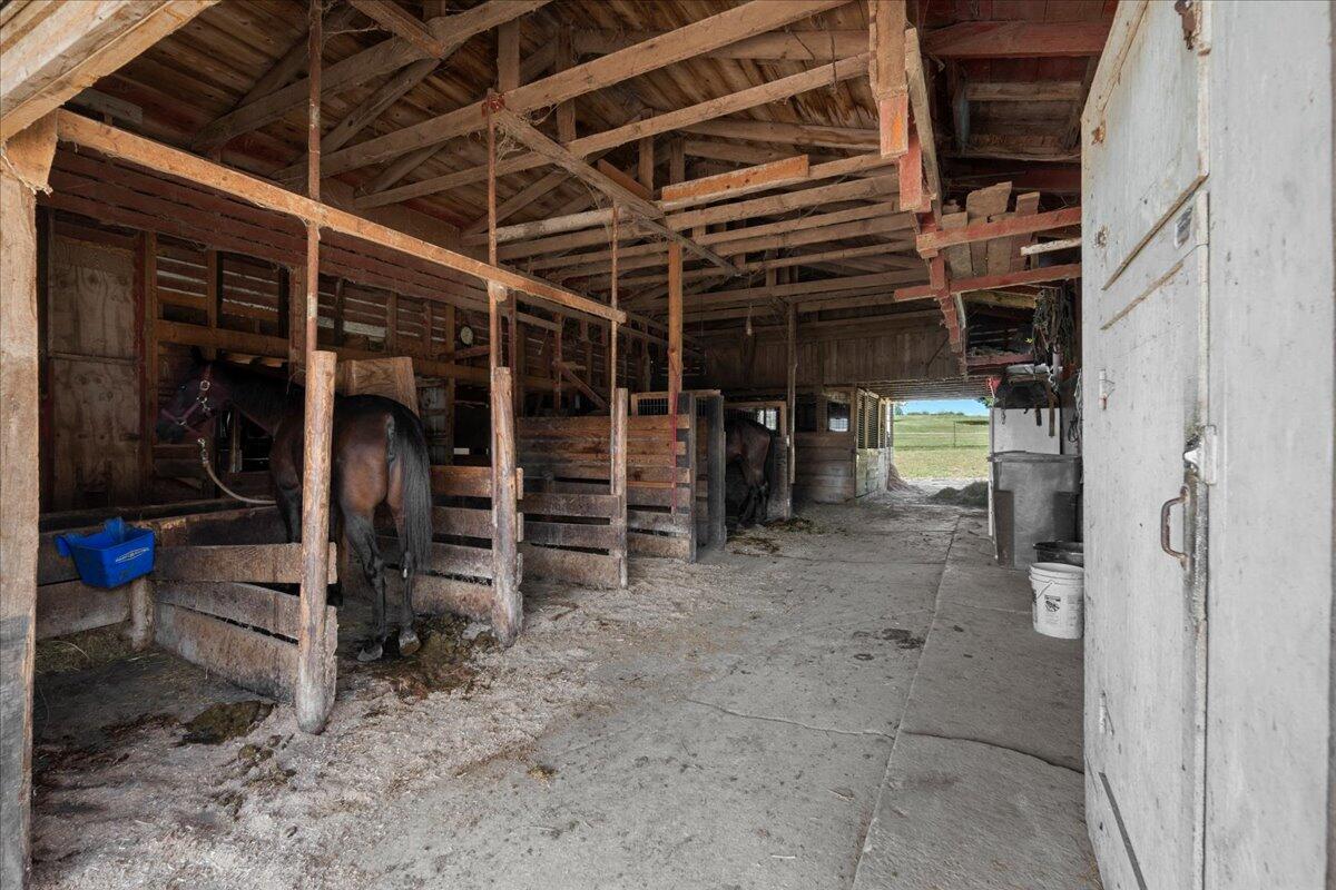 W1731 Kiel Road Elkhart Lake, WI 53020 - Photo 14 of 50 inside horse barn