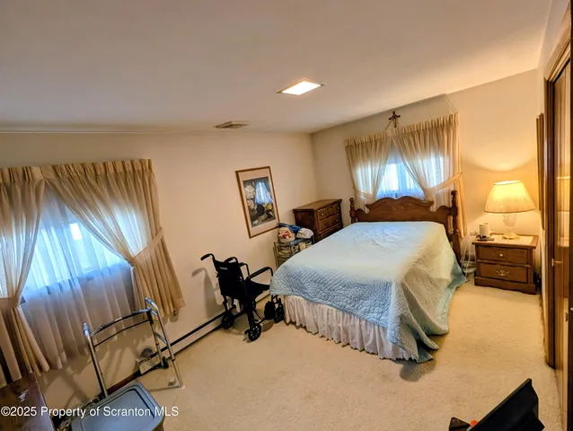 a bed room with a bed and a window