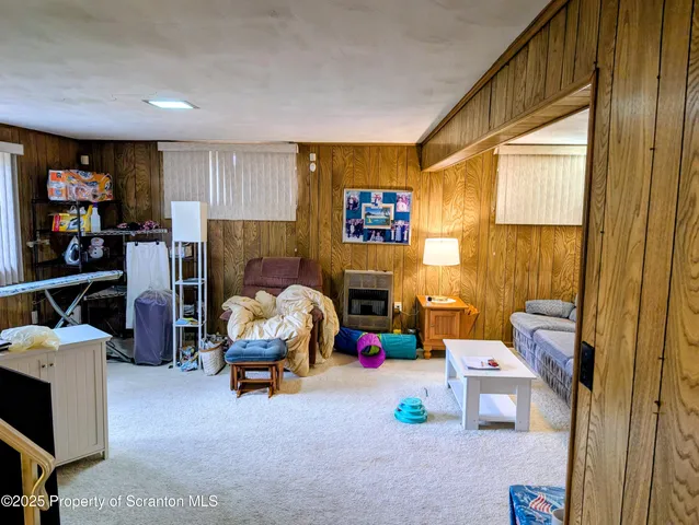 a bedroom with furniture and a fireplace
