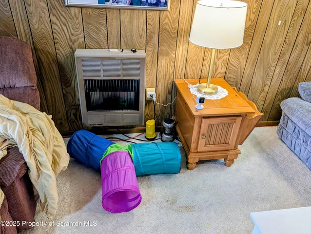 a bedroom with a bed and a table