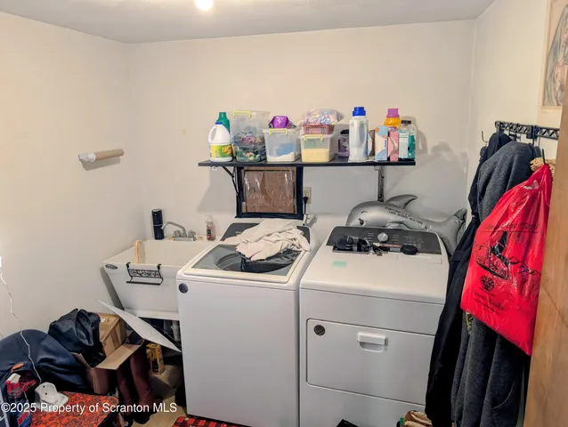 a view of storage and utility room with washer and dryer