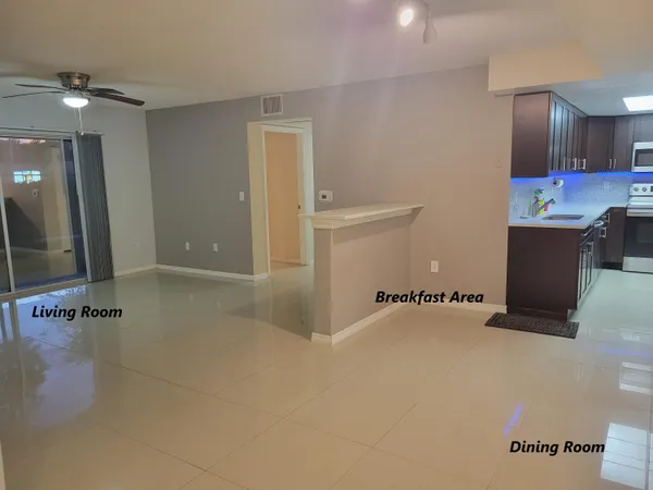 a kitchen with stainless steel appliances a refrigerator a stove and a sink