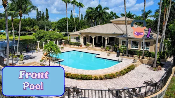 a view of a swimming pool with a yard