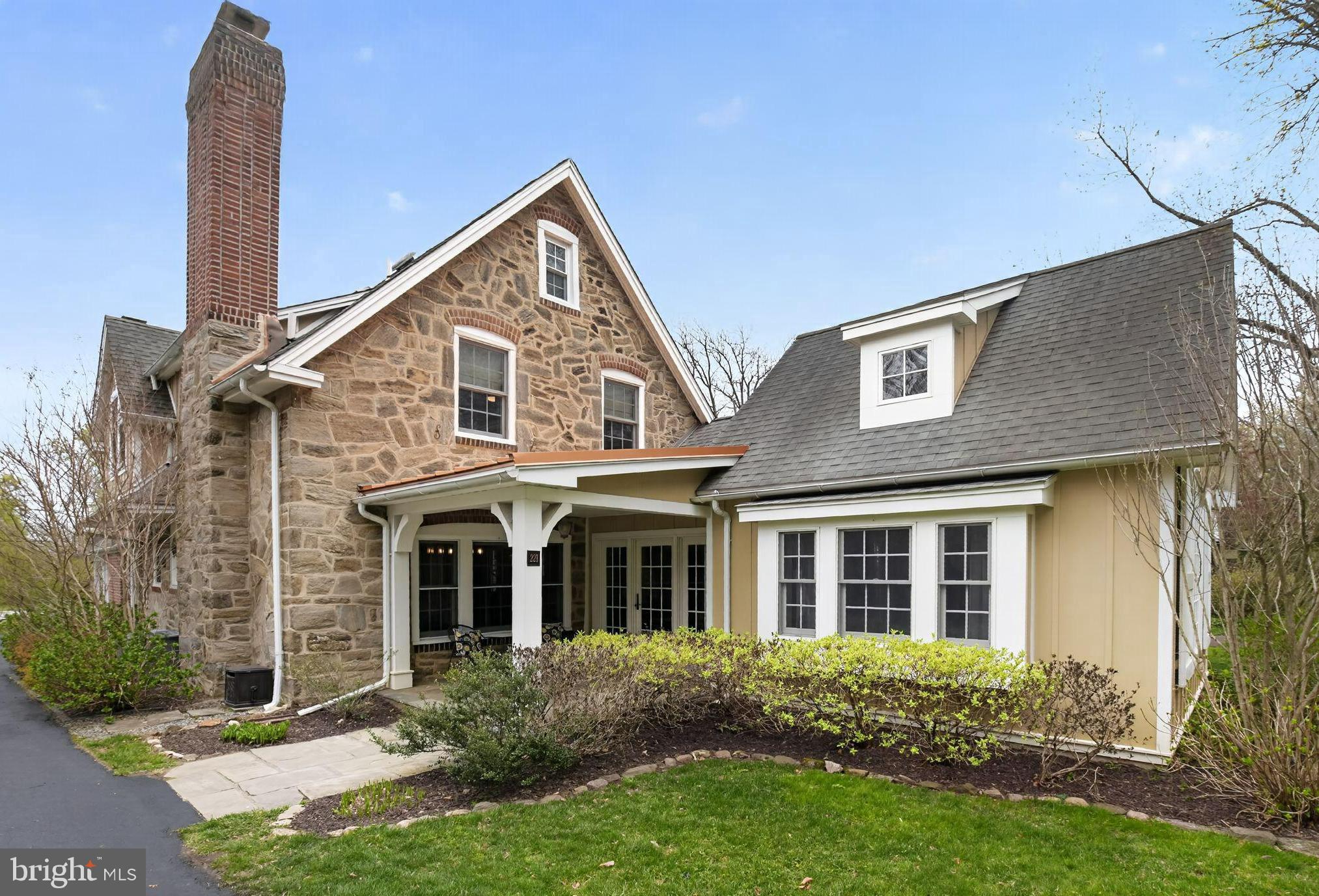 221 North Bent Road Wyncote, PA 19095 - Photo 1 of 1 a view of a house with brick walls and a yard with plants