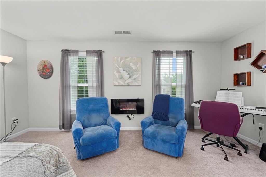 230 Augusta Walk Canton, GA 30114 - Photo 27 of 56 a living room with furniture kitchen view and a window