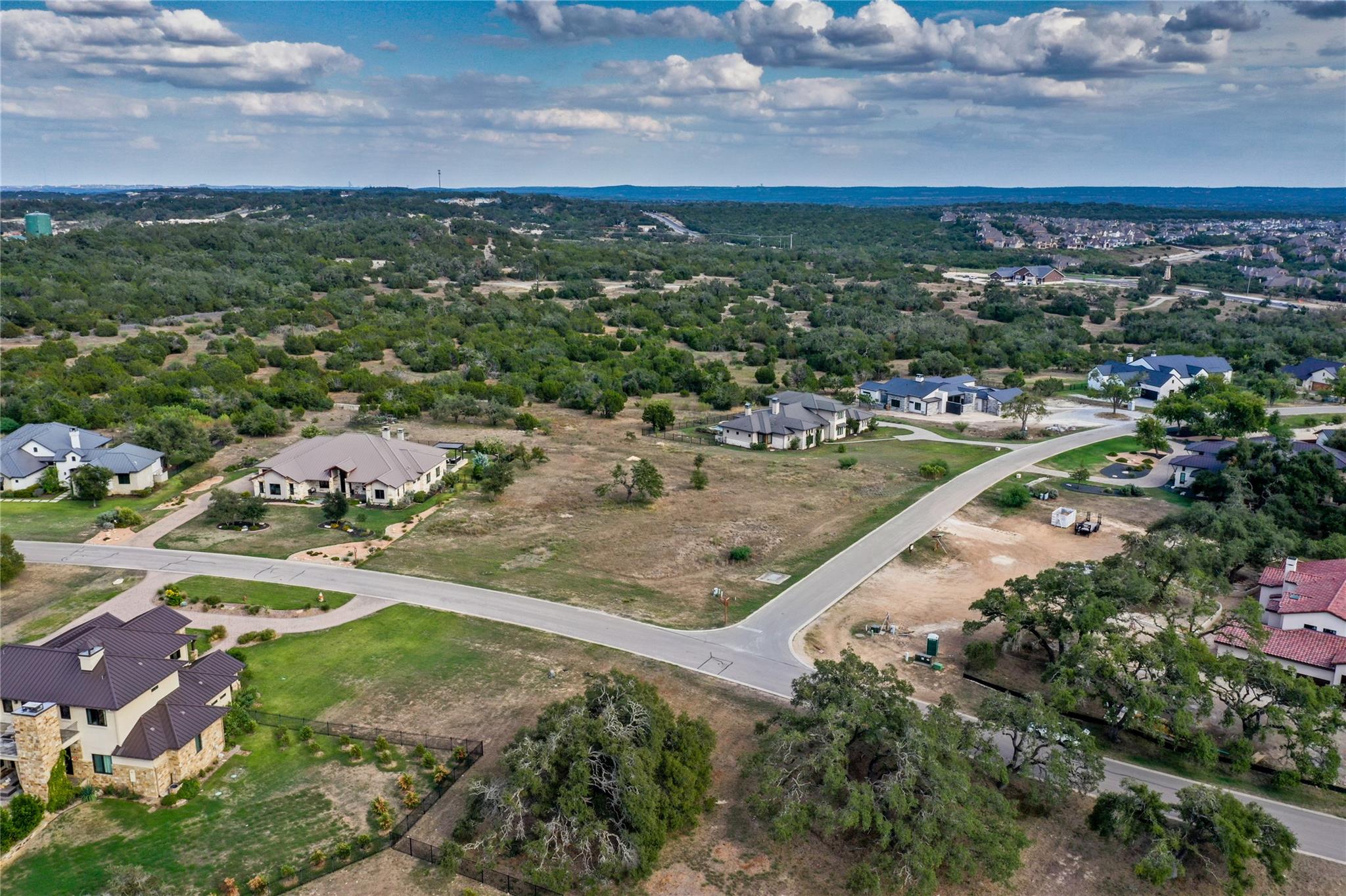 8501 Springdale Ridge Cove Austin, TX 78738 - Photo 4 of 5 an aerial view of residential houses with outdoor space