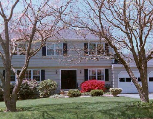 279 Adley Road Fairfield, CT 06825 - Photo 1 of 1 a front view of a house with garden