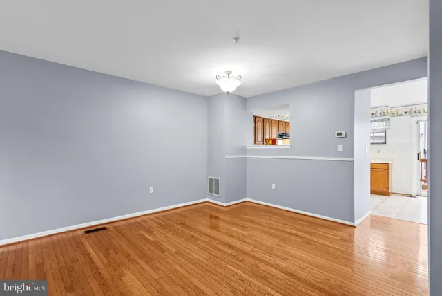 a kitchen with stainless steel appliances granite countertop a refrigerator a sink and a stove