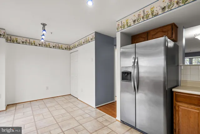 a bathroom with a glass shower door and a mirror