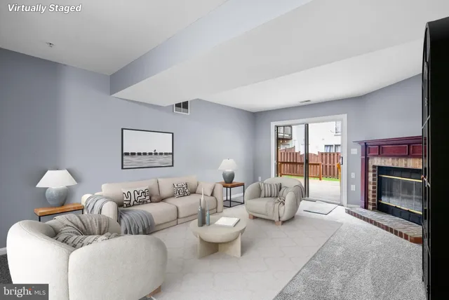 a living room with furniture fireplace and a flat screen tv