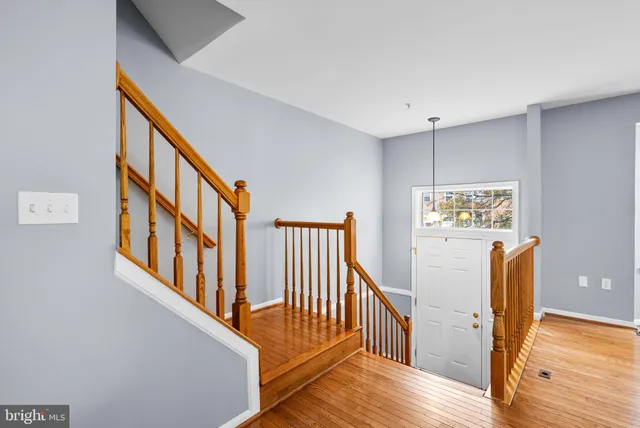 a view of an entryway with wooden floor