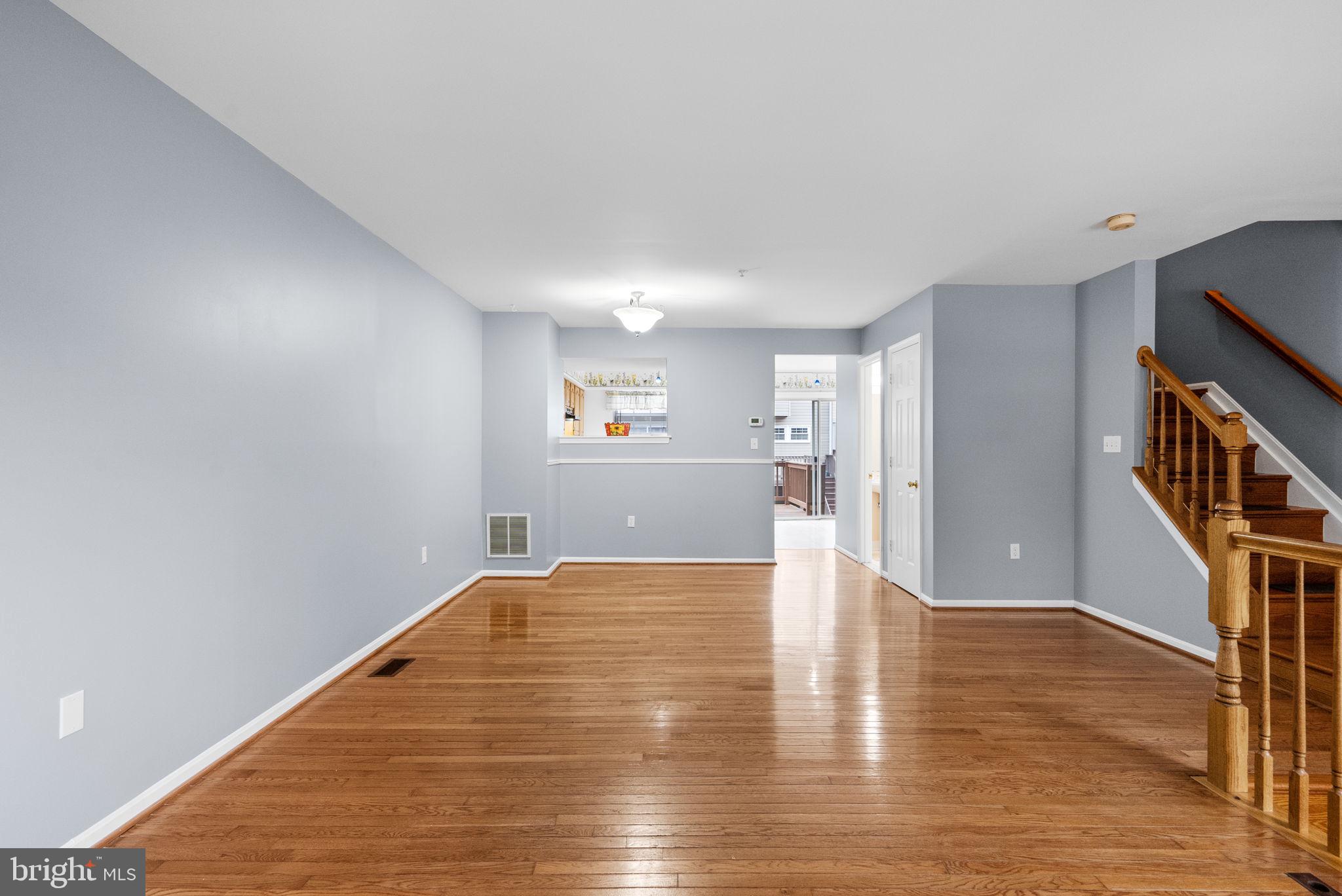 1346 Waterway Court, Unit 186 Curtis Bay, MD 21226 - Photo 8 of 44 a view of an empty room with wooden floor and a window
