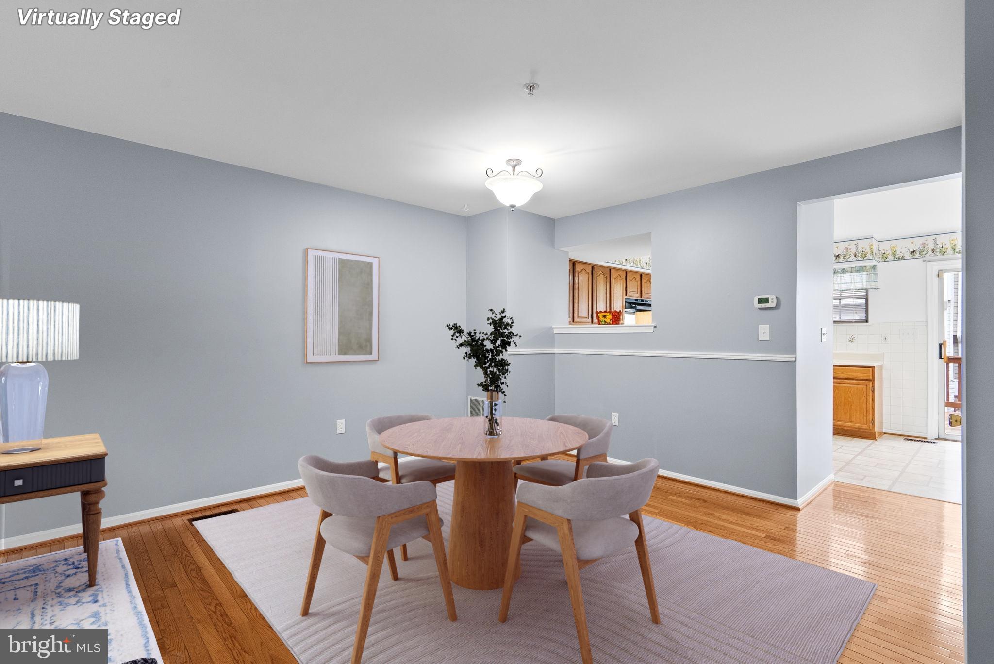 1346 Waterway Court, Unit 186 Curtis Bay, MD 21226 - Photo 9 of 44 a dining room with furniture and wooden floor
