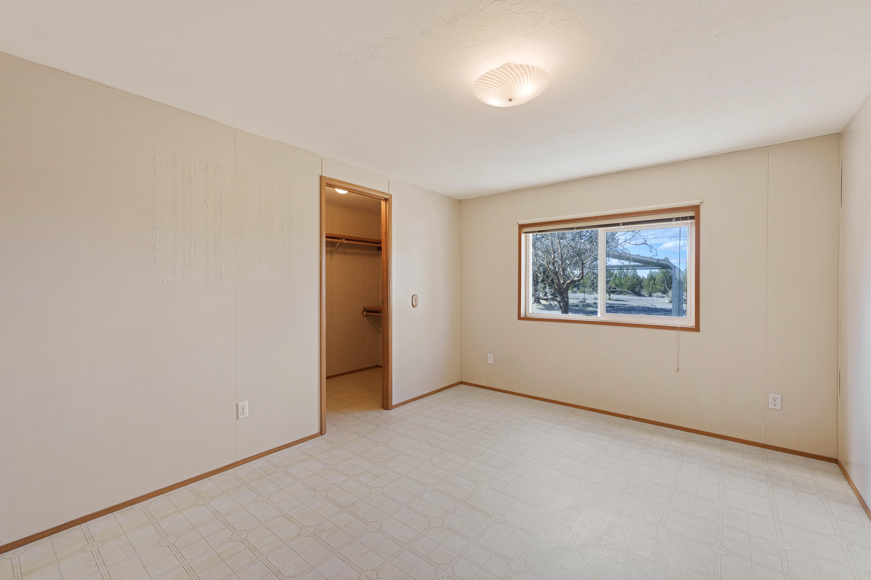 5674 Southeast Davis Loop Prineville, OR 97754 - Photo 24 of 48 an empty room with a window