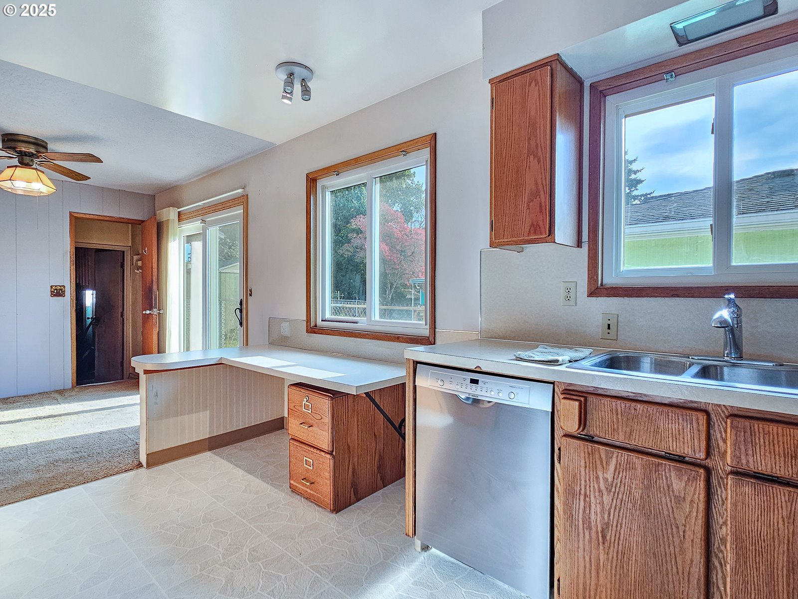 7750 North Decatur Street Portland, OR 97203 - Photo 11 of 28 a kitchen with a sink stove and cabinets