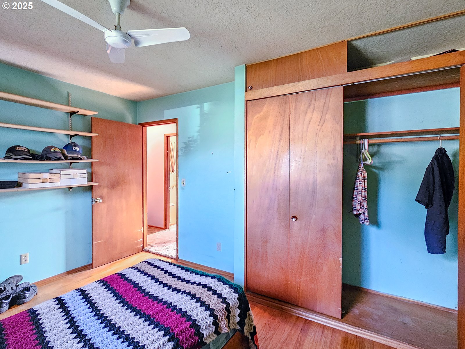 7750 North Decatur Street Portland, OR 97203 - Photo 19 of 28 a bedroom with a bed and a mirror on the dresser