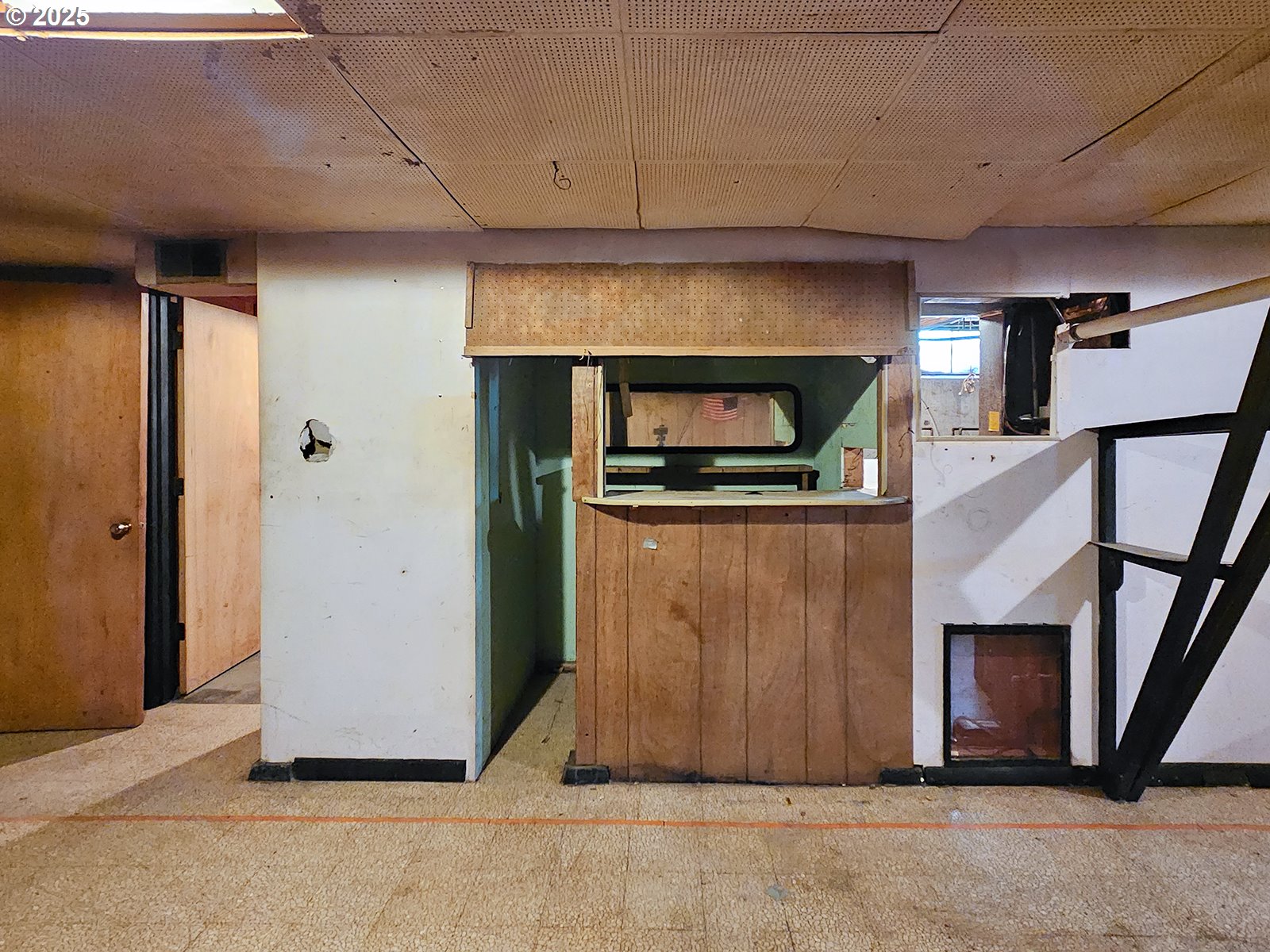 7750 North Decatur Street Portland, OR 97203 - Photo 22 of 28 a living room with stainless steel appliances wooden floor and staircase
