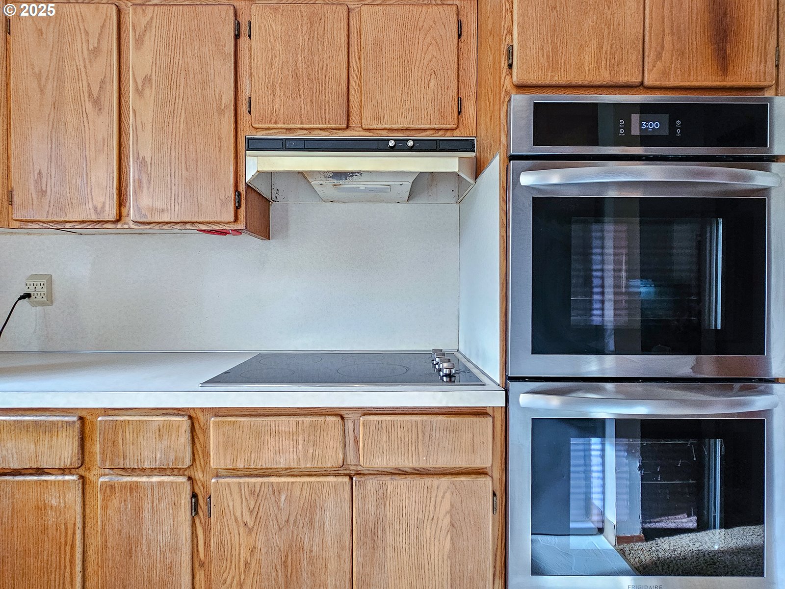 7750 North Decatur Street Portland, OR 97203 - Photo 9 of 28 a kitchen with granite countertop cabinets stainless steel appliances and a counter space