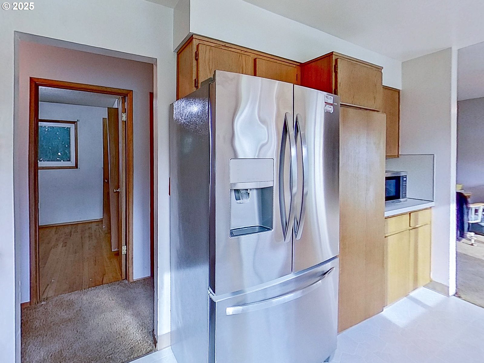 7750 North Decatur Street Portland, OR 97203 - Photo 10 of 28 a bathroom with a refrigerator and a sink