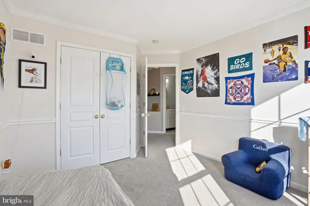 a bedroom with furniture and a wooden floor