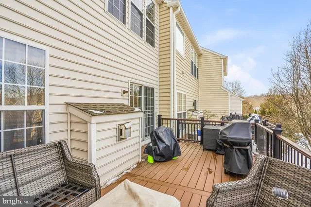 a view of a patio with a table and chairs