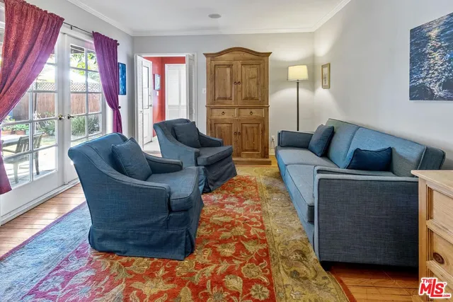 a living room with furniture and a rug