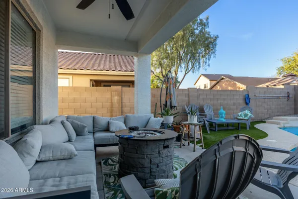 a view of a patio with couches table and chairs